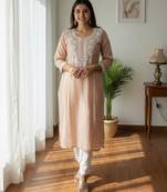 Peach chikankari kurta with intricate neckline