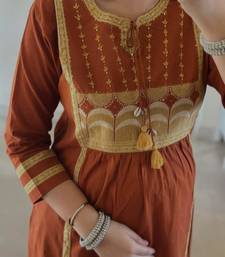 Rust kurta set with tassel accents