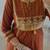 Rust kurta set with tassel accents