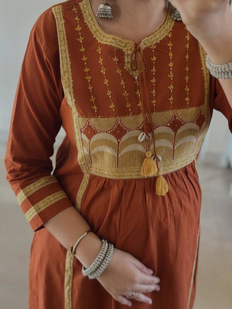 Rust kurta set with tassel accents