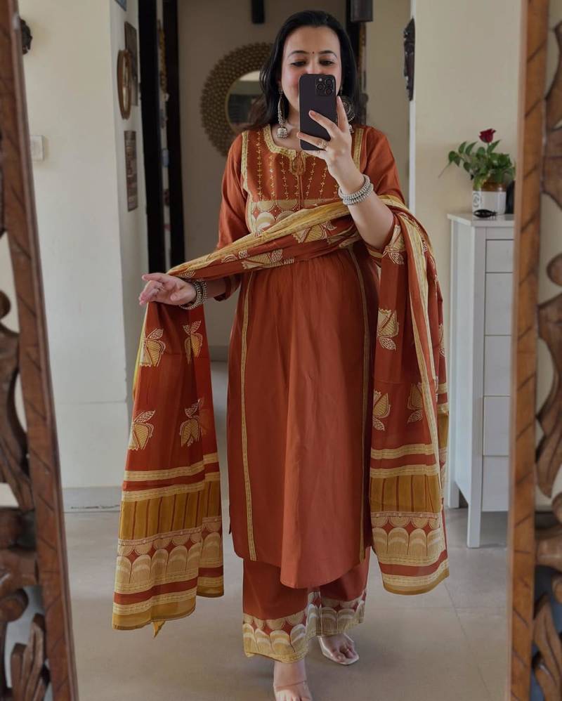 Rust kurta set with tassel accents