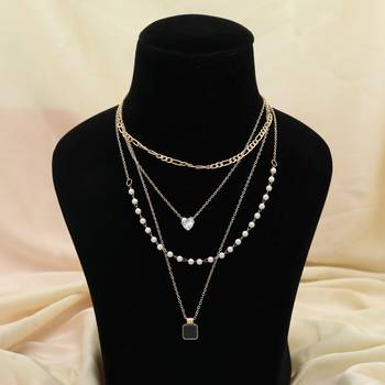 black color multi layer chain necklace with pearl detail 1