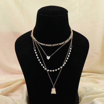 white color multi layer chain necklace with pearl detail 1