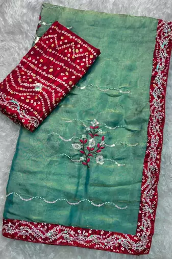 Teal green saree with red blouse