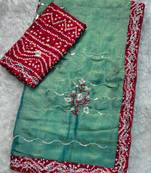 Teal green saree with red blouse
