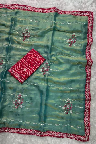 Teal green saree with red blouse