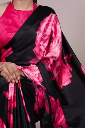 Black satin saree with pink floral print