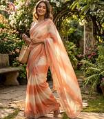 Peach tie-dye saree with elegant border