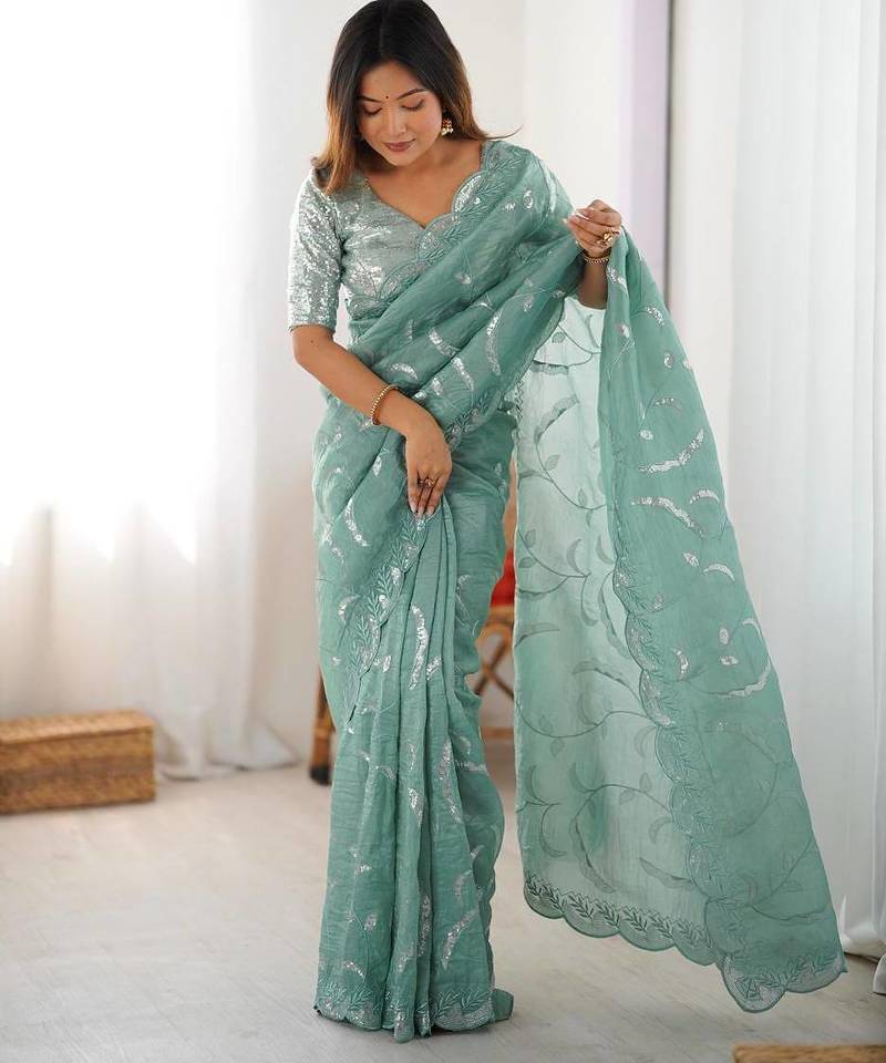 Pastel green embroidered saree