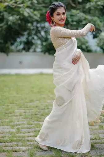 Off White linen saree with embroidered blouse