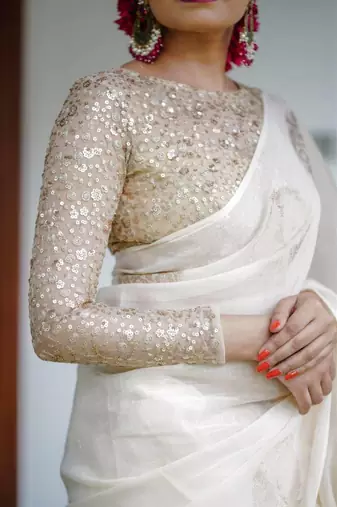 Off White linen saree with embroidered blouse