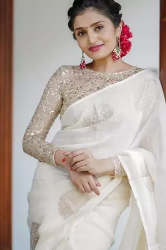 Off White linen saree with embroidered blouse