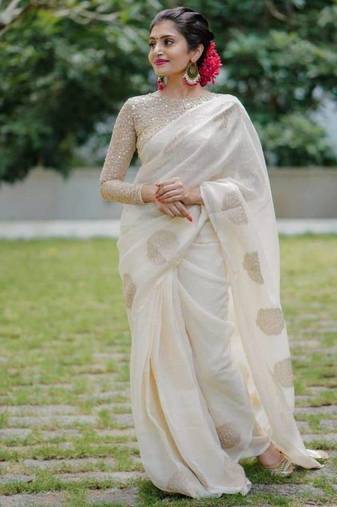 Off White linen saree with embroidered blouse