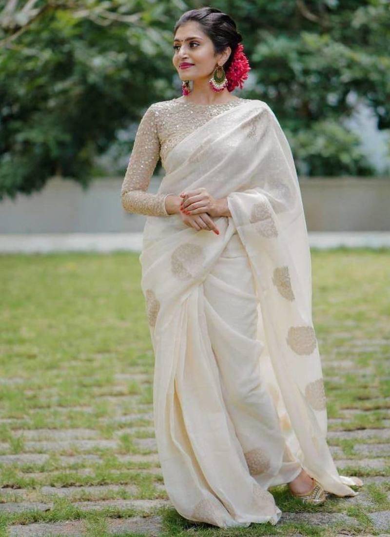 Off White linen saree with embroidered blouse