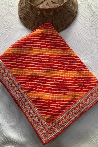 Orange leheriya printed embroidered saree