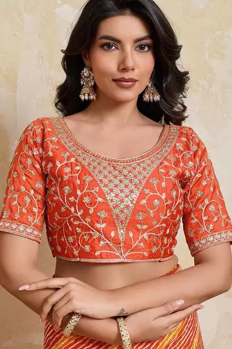 Orange leheriya printed embroidered saree