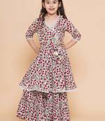 White red floral with green sleeves likely cotton angrakha-style top kurti with sharara / lehenga-style bottom set