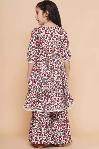 White red floral with green sleeves likely cotton angrakha-style top kurti with sharara / lehenga-style bottom set