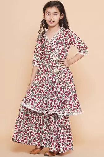 White red floral with green sleeves likely cotton angrakha-style top kurti with sharara / lehenga-style bottom set