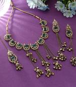 green color kundan necklace set with earrings and maang tikka