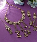 gold color kundan necklace set with earrings and maang tikka