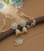 white kundan jhumka earrings with matching tikka set