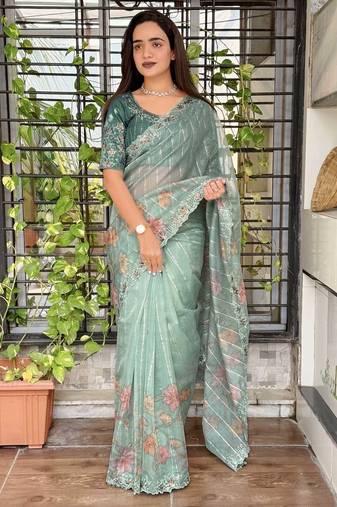 Teal organza zari weaving embroiderd saree with embroiderd blouse piece