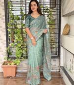 Teal organza zari weaving embroiderd saree with embroiderd blouse piece