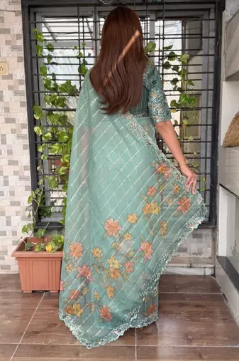 Teal organza zari weaving embroiderd saree with embroiderd blouse piece