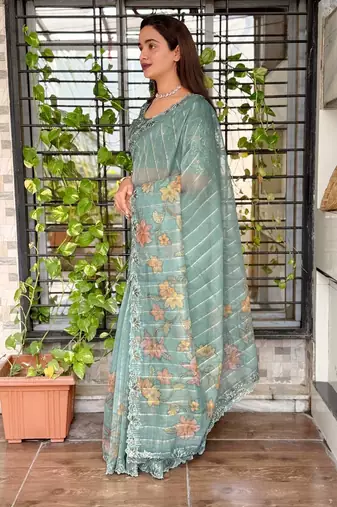 Teal organza zari weaving embroiderd saree with embroiderd blouse piece