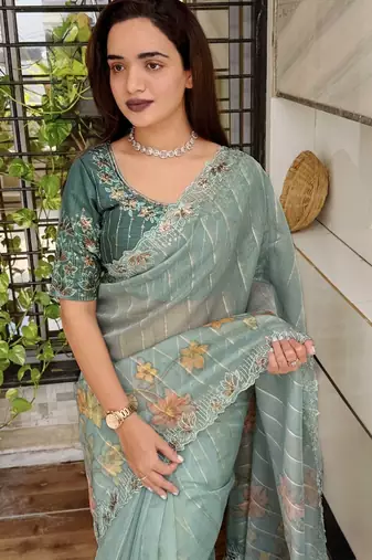 Teal organza zari weaving embroiderd saree with embroiderd blouse piece