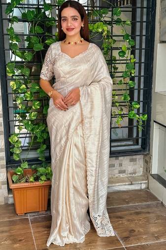 Cream tussar cotton embroidery work saree with matching blouse piece