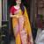 Yellow soft silk saree with unstitched blouse piece