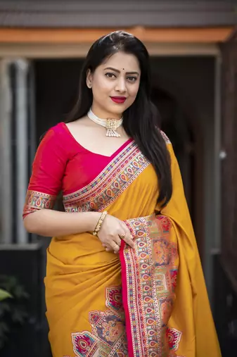 Yellow soft silk saree with unstitched blouse piece