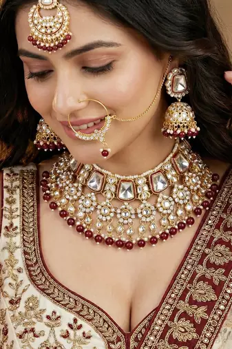 Gold plated maroon kundan bridal & semi-bridal necklace set with tikka & nath
