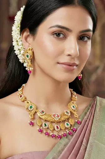 Antique gold-tone peacock temple necklace set with earrings for wedding wear