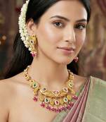Antique gold-tone peacock temple necklace set with earrings for wedding wear