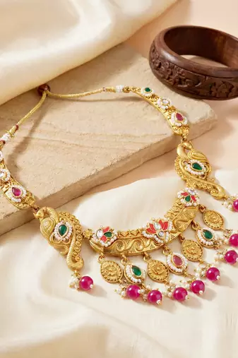 Antique gold-tone peacock temple necklace set with earrings for wedding wear