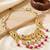 Antique gold-tone peacock temple necklace set with earrings for wedding wear