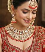 18 kt gold plated red kundan bridal necklace set with tikka & nath