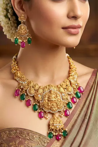 Gold-tone antique temple bridal necklace set with earrings for wedding wear