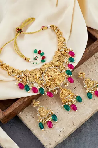 Gold-tone antique temple bridal necklace set with earrings for wedding wear