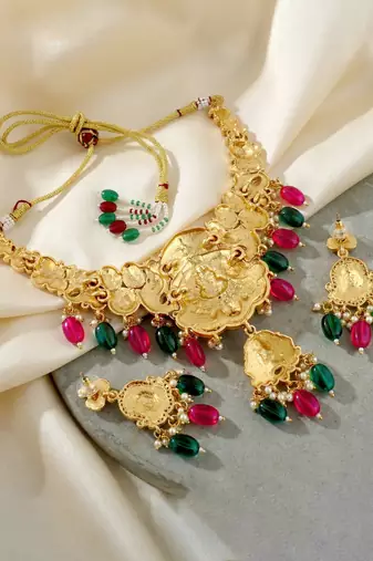 Gold-tone antique temple bridal necklace set with earrings for wedding wear