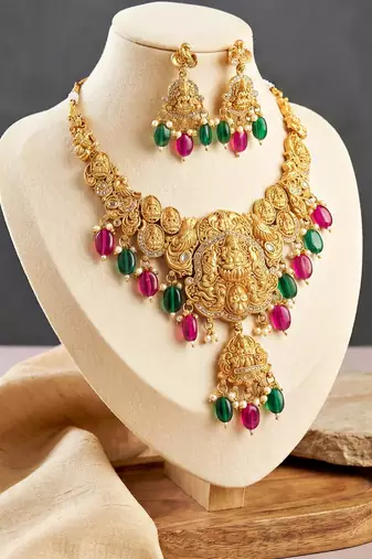 Gold-tone antique temple bridal necklace set with earrings for wedding wear