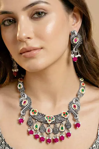 Antique silver-tone peacock temple necklace set with earrings for festive wear