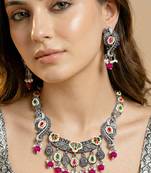 Antique silver-tone peacock temple necklace set with earrings for festive wear