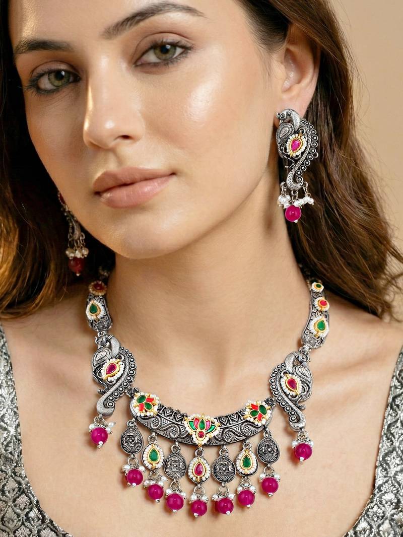 Antique silver-tone peacock temple necklace set with earrings for festive wear