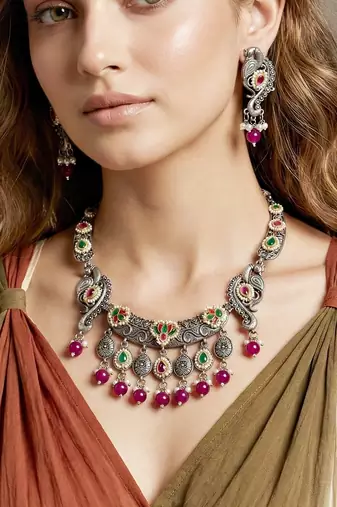 Antique silver-tone peacock temple necklace set with earrings for festive wear