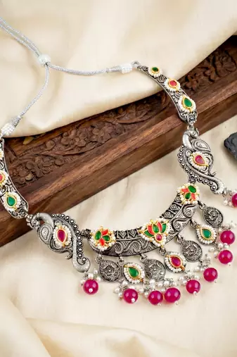 Antique silver-tone peacock temple necklace set with earrings for festive wear