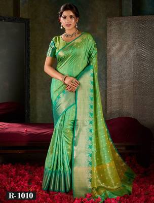 Mint green and emerald silk saree with traditional gold zari accents 1